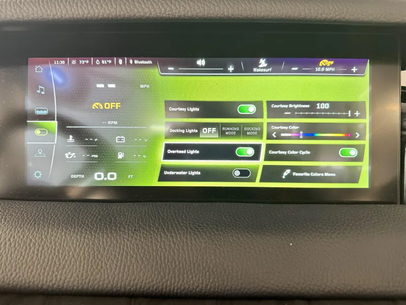 Slide: The Image of 2024 Nautique S23 touchscreen control panel displaying various boat settings. - 17