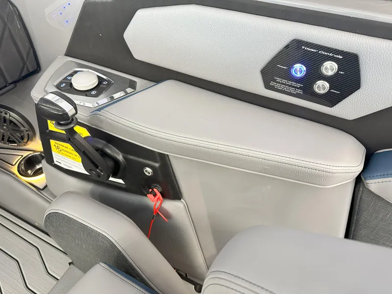 Slide: The Image of 2024 Nautique S23 boat control panel and throttle. - 19