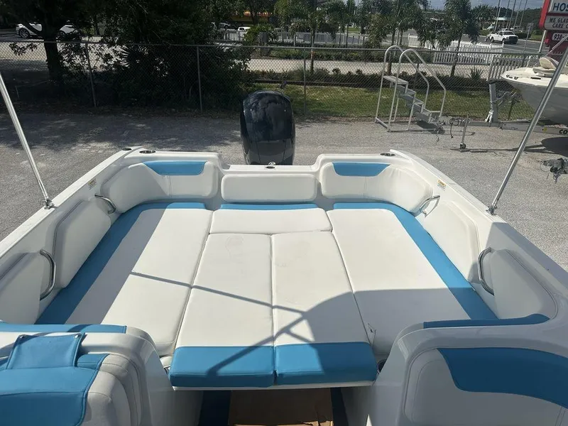 Slide: The Image of 2024 Bayliner Element E21 boat interior with white and blue seating. - 12