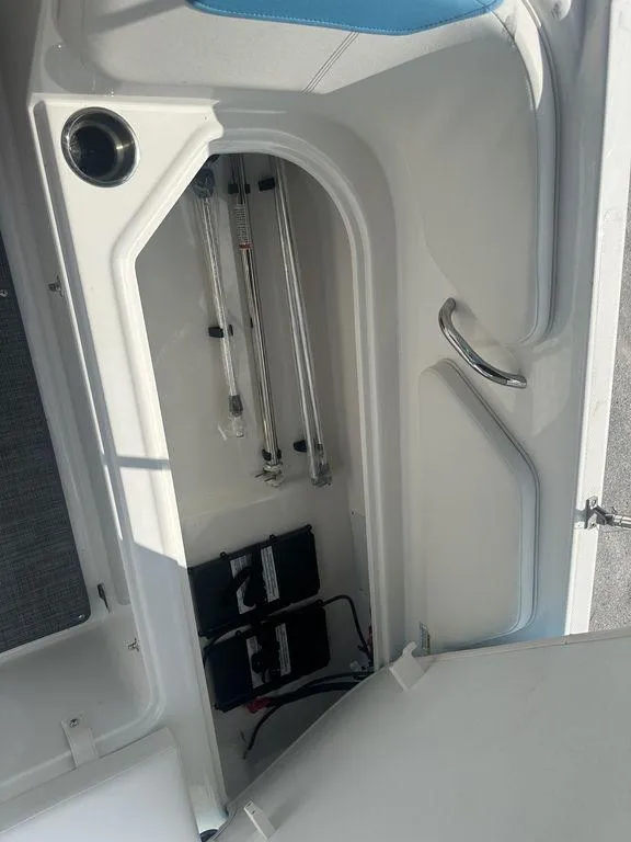 Slide: The Image of 2024 Bayliner Element E21 storage compartment with battery and equipment. - 13