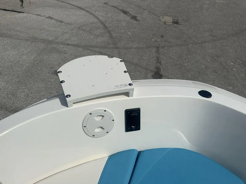 Slide: The Image of 2024 Bayliner Element E21 boat interior with blue seating and white deck. - 16