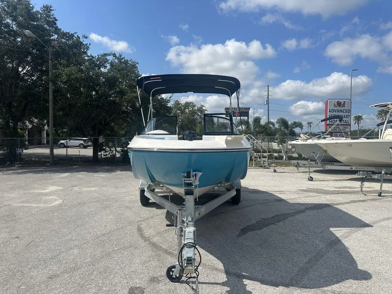 Slide: The Image of 2024 Bayliner Element E21 boat on trailer in outdoor lot. - 5