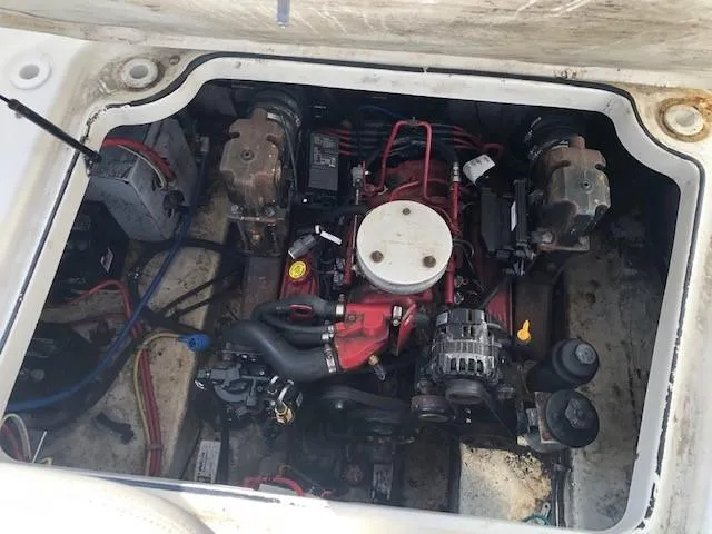 Slide: The Image of 2008 Glastron GS 259 boat engine compartment with visible components. - 14