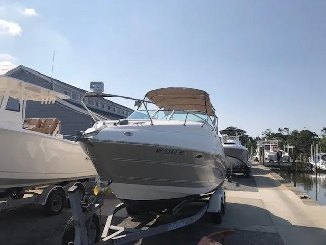 Slide: The Image of 2008 Glastron GS 259 boat on trailer at marina. - 3