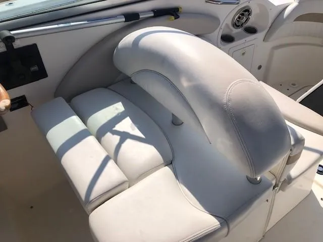Slide: The Image of 2008 Glastron GS 259 boat interior with white leather seating. - 8