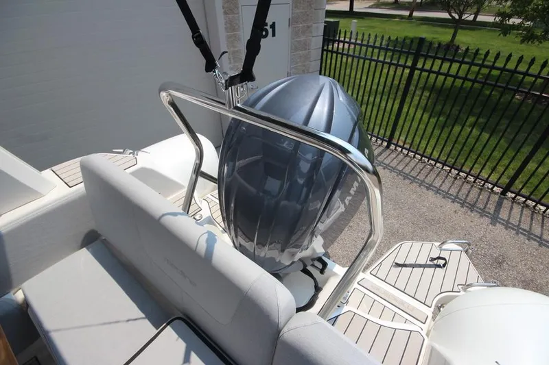Slide: The Image of 2024 Zodiac Medline 7.5 NEO 300hp boat, rear view with engine and seating. - 10