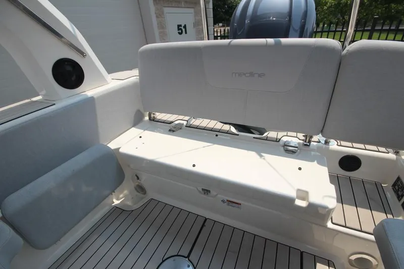 Slide: The Image of 2024 Zodiac Medline 7.5 NEO 300hp boat interior with cushioned seating and storage. - 13