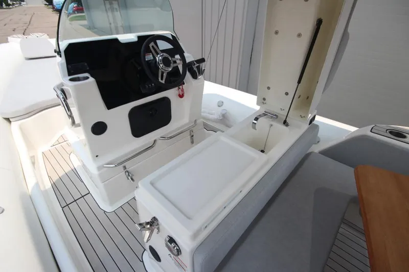 Slide: The Image of 2024 Zodiac Medline 7.5 NEO 300hp boat interior with open storage compartment. - 16