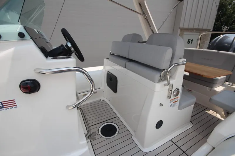 Slide: The Image of 2024 Zodiac Medline 7.5 NEO 300hp boat interior with seating and steering console. - 19