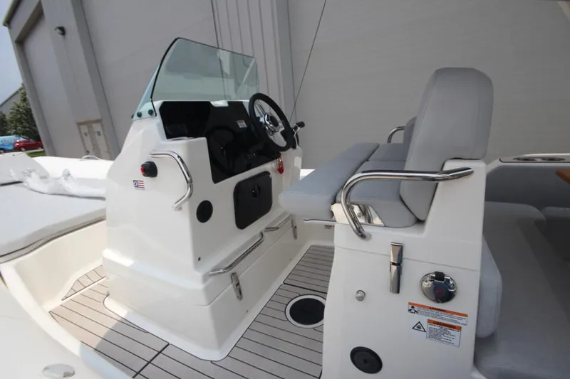 Slide: The Image of 2024 Zodiac Medline 7.5 NEO 300hp boat interior with steering console and seating. - 20
