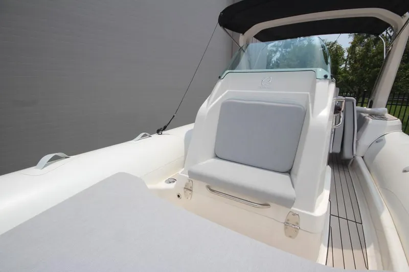 Slide: The Image of 2024 Zodiac Medline 7.5 NEO 300hp boat interior with cushioned seating. - 24