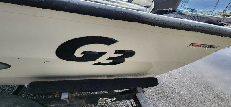 Slide: The Image of 2022 G3 Sportsman 1710 boat side view with logo. - 12