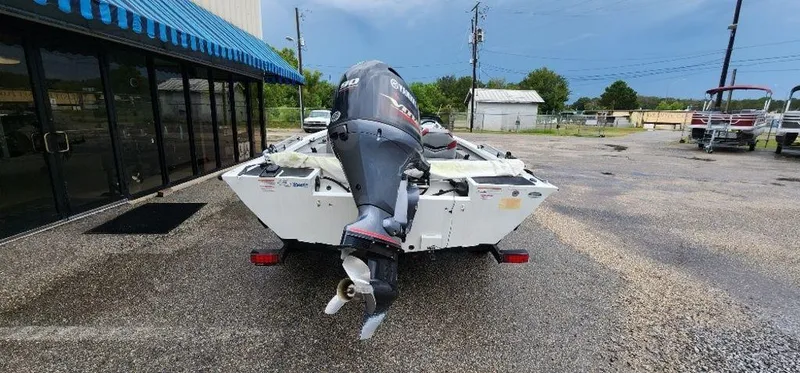 Slide: The Image of 2022 G3 Sportsman 1710 boat with outboard motor on trailer. - 14