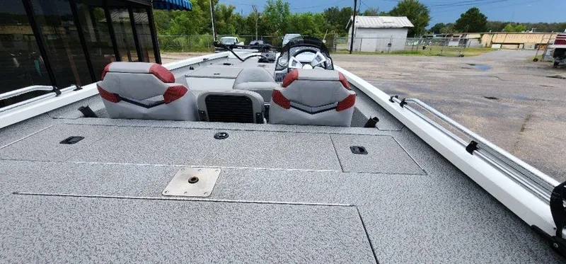 Slide: The Image of 2022 G3 Sportsman 1710 boat interior with gray seating and spacious deck. - 15