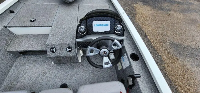 Slide: The Image of 2022 G3 Sportsman 1710 boat dashboard with Lowrance display and steering wheel. - 19
