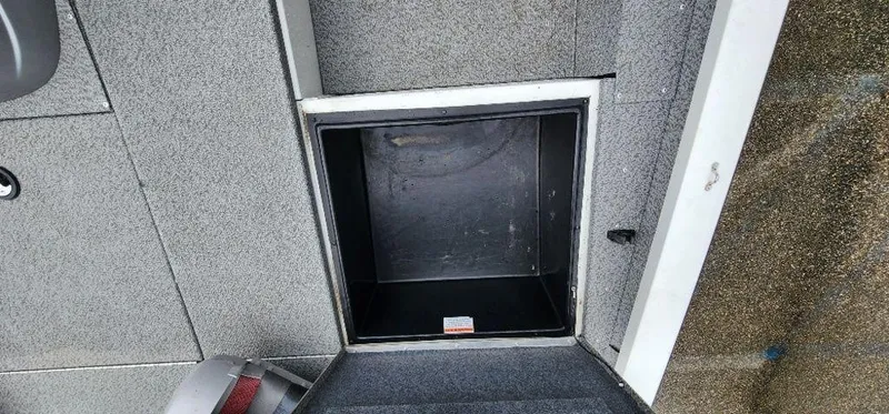 Slide: The Image of Open storage compartment on 2022 G3 Sportsman 1710 boat deck. - 20