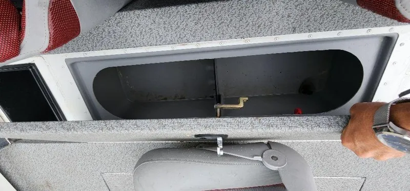 Slide: The Image of 2022 G3 Sportsman 1710 boat storage compartment with open lid. - 25