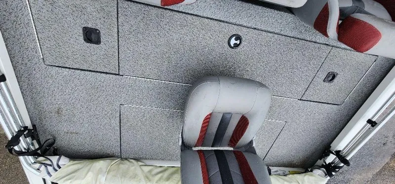 Slide: The Image of 2022 G3 Sportsman 1710 boat interior with gray and red seating and storage compartments. - 26