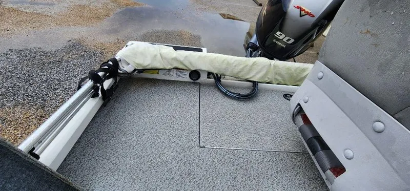 Slide: The Image of 2022 G3 Sportsman 1710 boat interior with motor and storage compartment. - 28