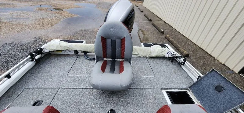 Slide: The Image of 2022 G3 Sportsman 1710 boat interior with gray and red seating. - 29