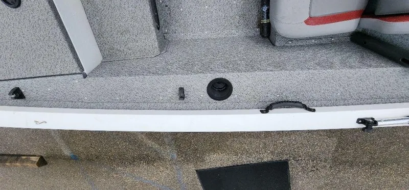 Slide: The Image of 2022 G3 Sportsman 1710 boat interior with gray textured flooring and seating. - 33