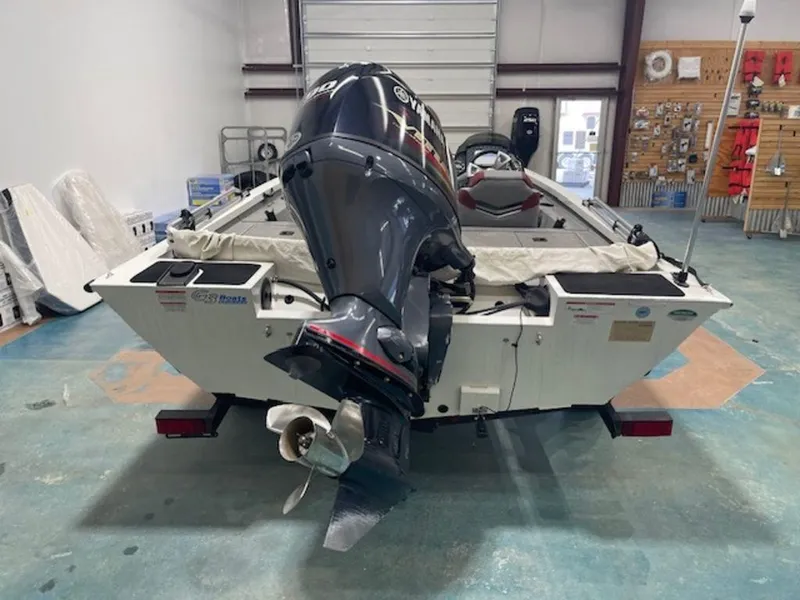Slide: The Image of 2022 G3 Sportsman 1710 boat with outboard motor in a garage. - 4