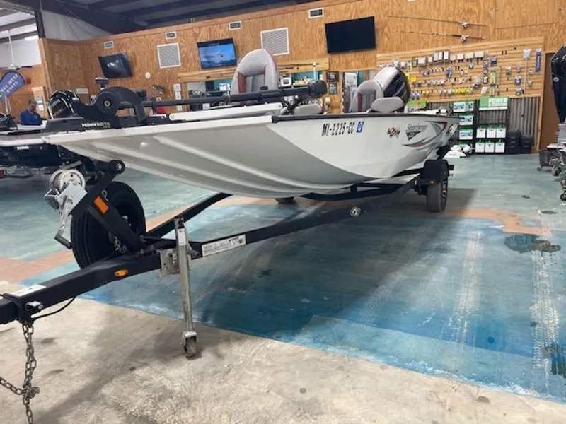 Slide: The Image of 2022 G3 Sportsman 1710 boat on trailer in showroom setting. - 5