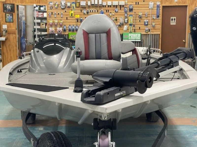 Slide: The Image of 2022 G3 Sportsman 1710 fishing boat in showroom, featuring trolling motor and comfortable seating. - 6