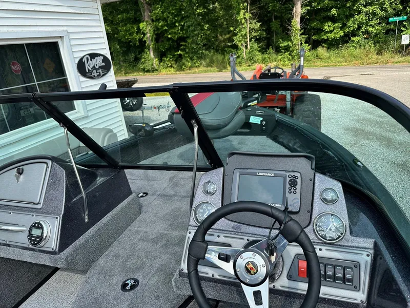 Slide: The Image of 2024 Ranger VS1682WT boat dashboard with steering wheel and navigation system. - 4