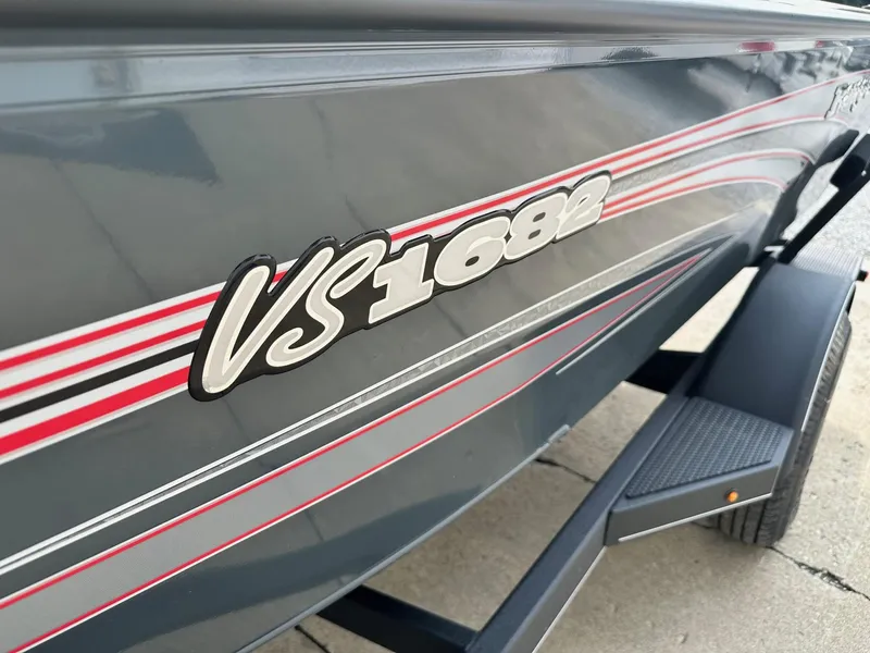 Slide: The Image of 2024 Ranger VS1682WT boat side view with model decal and trailer. - 8