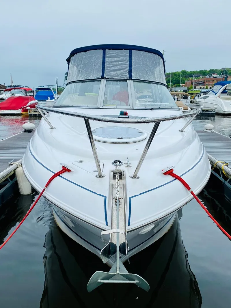 Slide: The Image of 2007 Four Winns Vista 258 boat docked at marina, front view. - 3