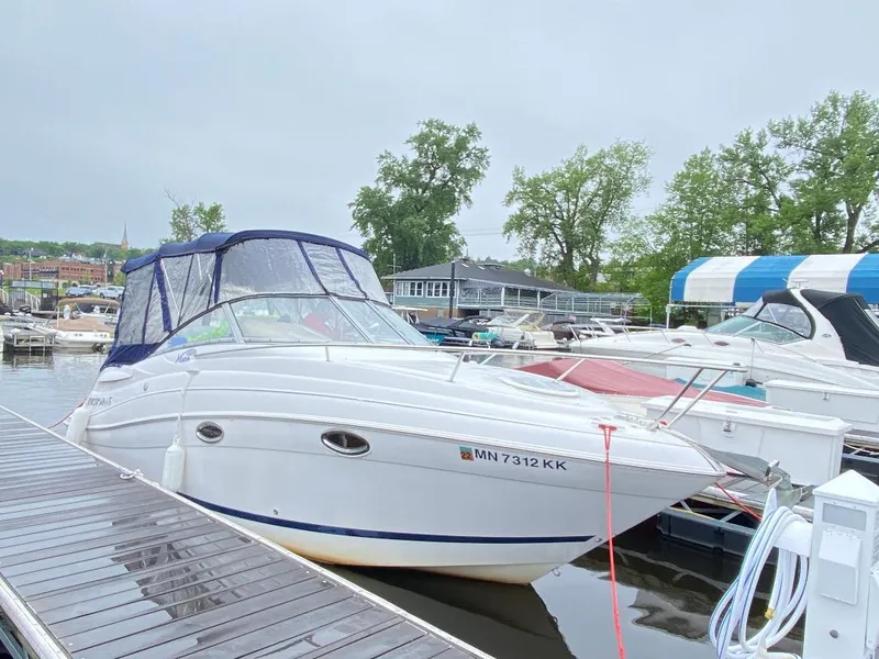Slide: The Image of 2007 Four Winns Vista 258 boat docked at a marina with canopy. - 5