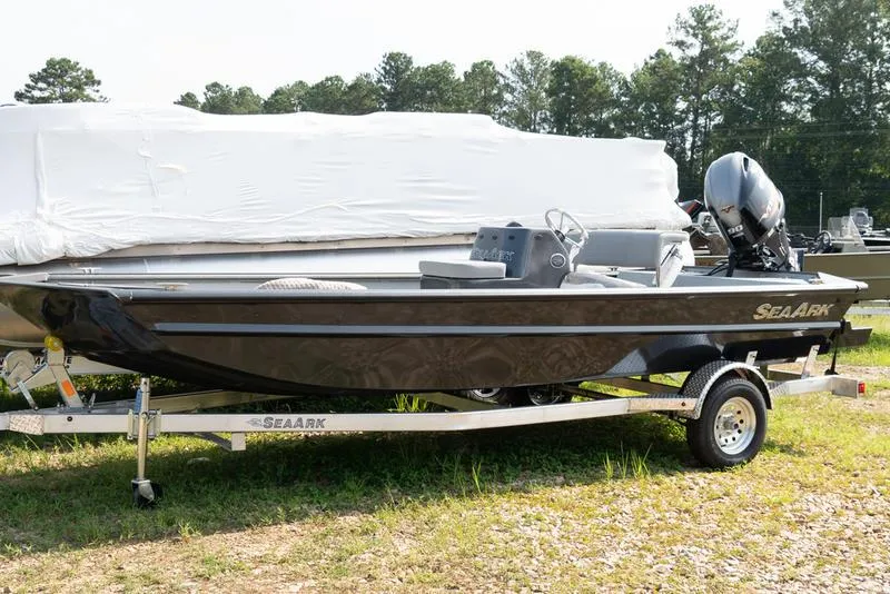 The Image of 2024 SeaArk RXT 180CC boat on trailer, side view, outdoors. - 0