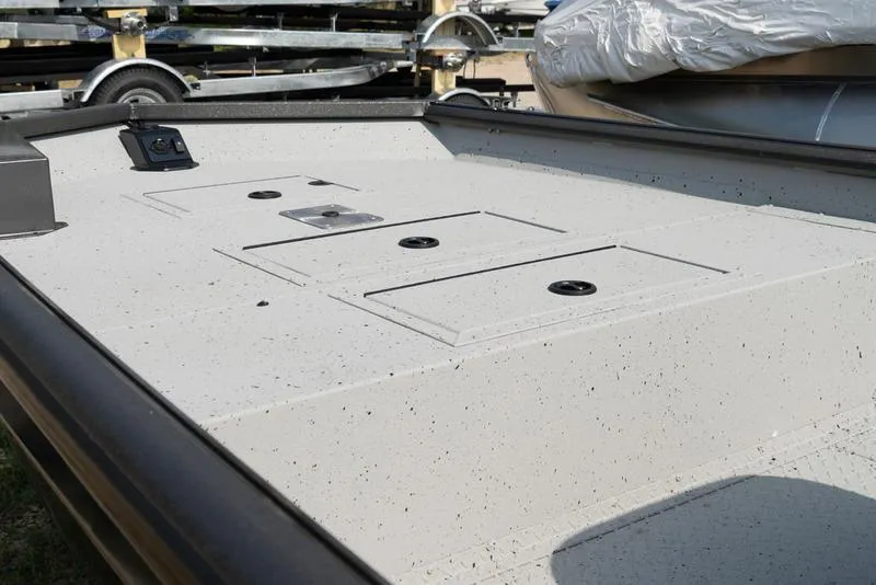 Slide: The Image of 2024 SeaArk RXT 180CC boat deck with storage compartments. - 2