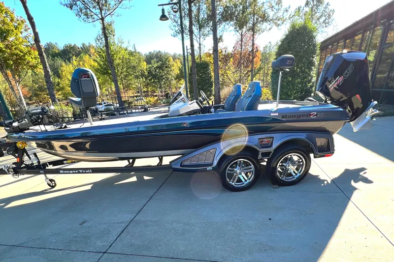 Slide: The Image of 2024 Ranger Z520R Ranger Cup Equipped boat on a trailer in a sunny outdoor setting. - 0