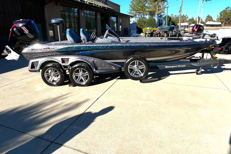 Slide: The Image of 2024 Ranger Z520R Ranger Cup Equipped boat on a trailer in a sunny outdoor setting. - 5