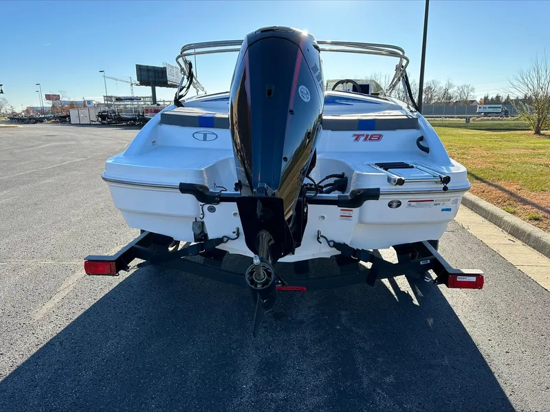 Slide: The Image of 2024 Tahoe T18 boat rear view with outboard motor on trailer. - 3