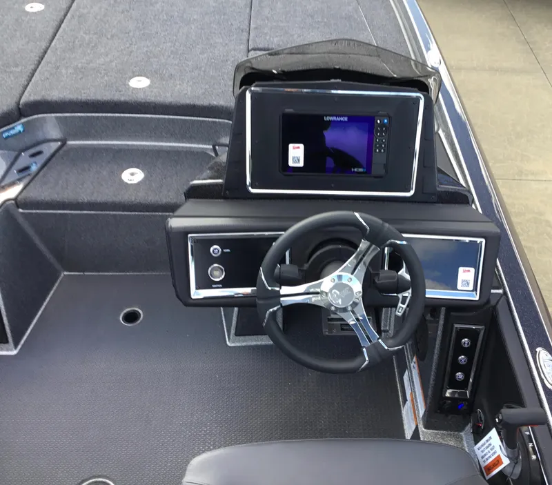 Slide: The Image of 2024 Ranger Z521R boat cockpit with steering wheel and navigation system. - 3