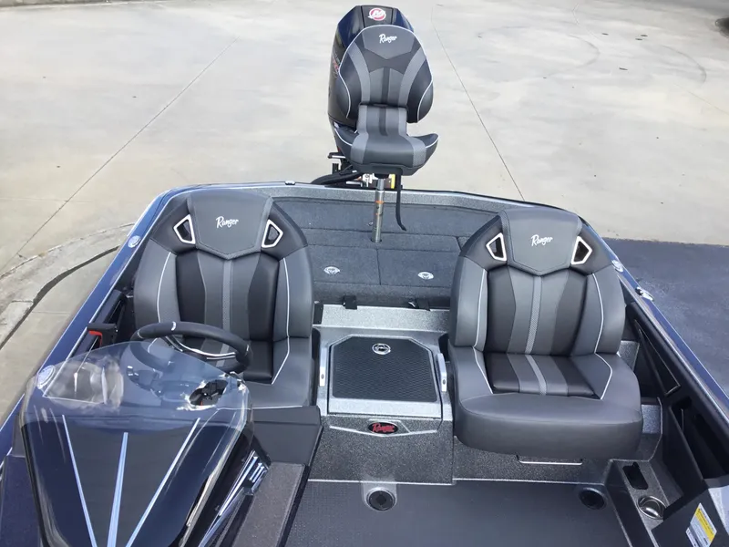 Slide: The Image of 2024 Ranger Z521R boat interior with black and gray seating. - 4