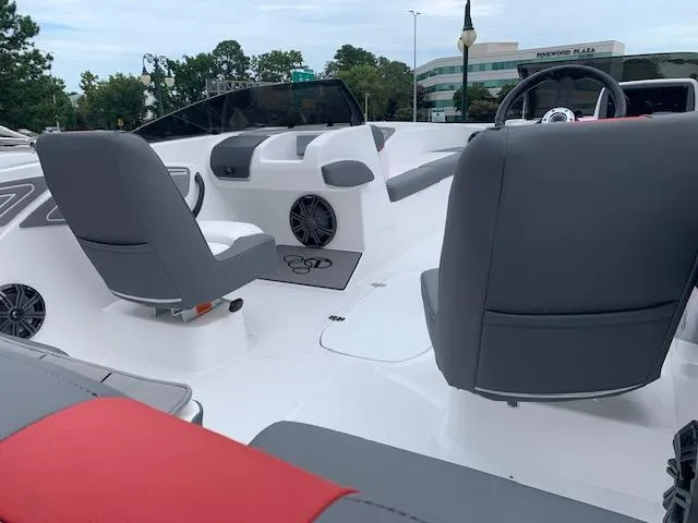 Slide: The Image of 2024 Tahoe T21 boat interior with gray seats and modern dashboard. - 2