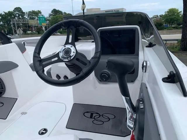 Slide: The Image of 2024 Tahoe T21 boat cockpit with steering wheel and control panel. - 3