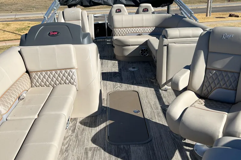Slide: The Image of 2024 Ranger Reata 223FC boat interior with luxurious seating and modern design. - 3