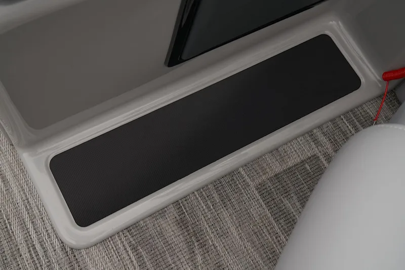 Slide: The Image of 2024 Ranger Reata 223FC interior step with non-slip mat and carpeted flooring. - 39