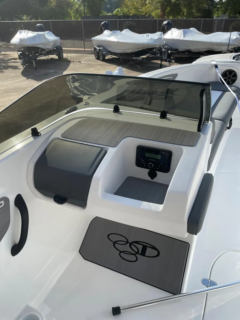 Slide: The Image of 2024 Tahoe T21 boat interior with dashboard and seating area. - 5