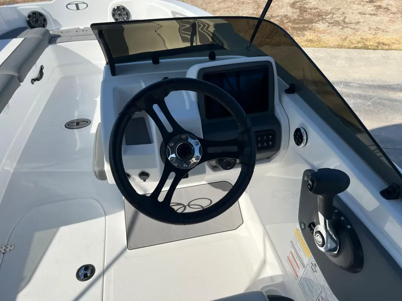 Slide: The Image of 2024 Tahoe T21 boat cockpit with steering wheel and control panel. - 5