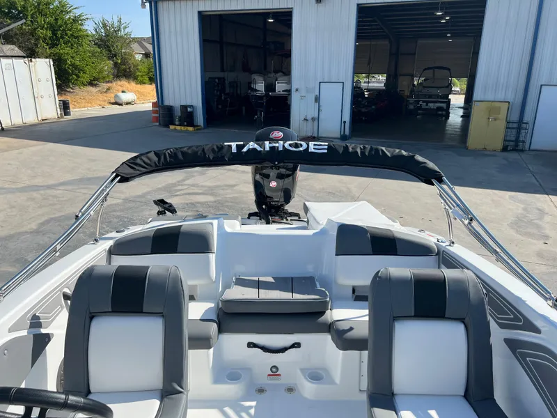 Slide: The Image of 2024 Tahoe T21 boat interior at a marina. - 8