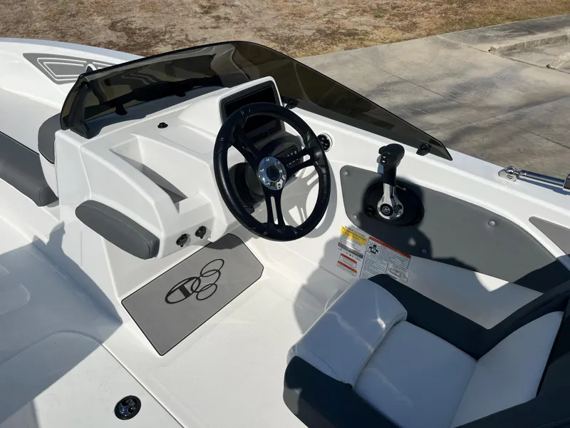 Slide: The Image of 2024 Tahoe T21 boat cockpit with steering wheel and control panel. - 9