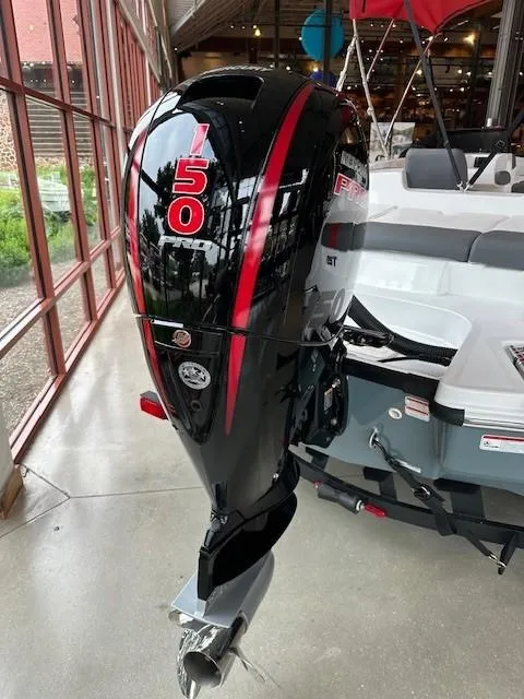 Slide: The Image of 2024 Tahoe T21 boat with a powerful 150 HP outboard motor. - 10