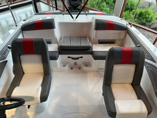 Slide: The Image of 2024 Tahoe T21 boat interior with red and gray seating. - 7