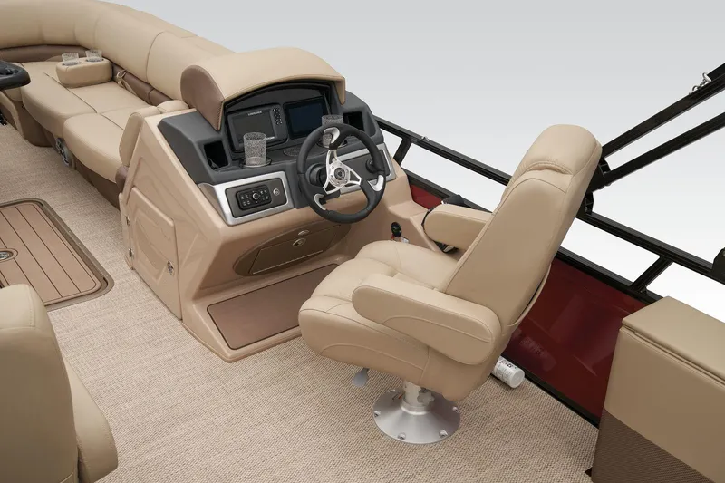 Slide: The Image of 2024 Regency 250 DL3 boat interior with beige captain's chair and control console. - 25